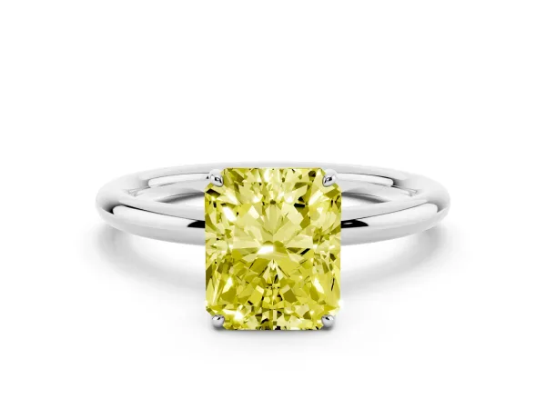 Fancy Yellow Radiant Cut Solitaire Diamond Ring with Four-Prong Setting on a Plain Band Platinum