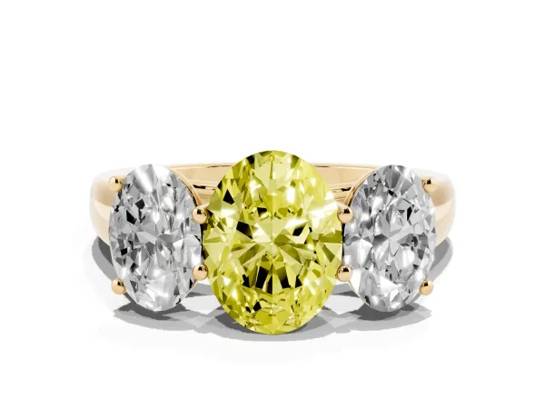 Fancy Yellow Oval Cut Three-Stone Diamond Ring with Prong Setting on a Classic Band Yellow gold