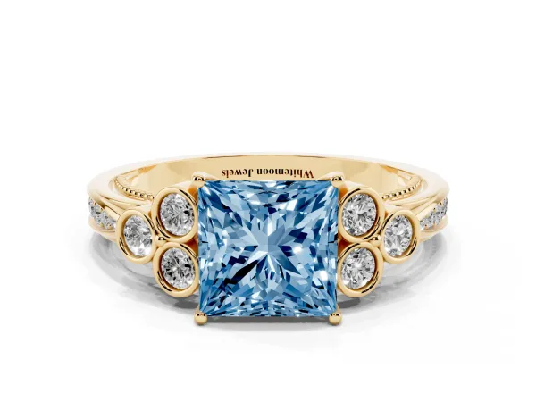 Fancy Blue Princess Cut Cut Diamond Engagement Ring with Bezel Set Round Side Stones and Prong Setting Yellow gold