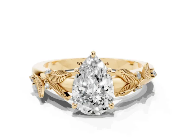 Pear Cut Diamond Solitaire Ring with Leaf Motif Band and Four-Prong Setting Yellow gold