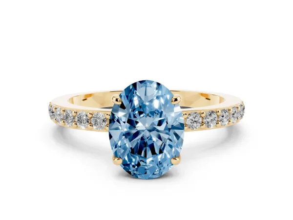 Fancy Blue Oval Cut Diamond Pavé Engagement Ring with Round Accents and Prong Setting Yellow gold
