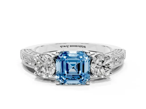 Fancy Blue Asscher Cut Three-Stone Diamond Ring with Pavé Band and Four-Prong Setting White gold