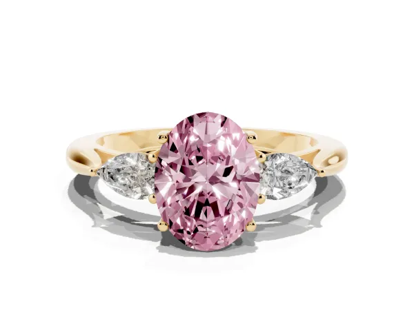 Fancy Pink Three-Stone Oval Cut Brilliant Diamond Solitaire Ring with Tapered Band and Four-Prong Setting Yellow gold