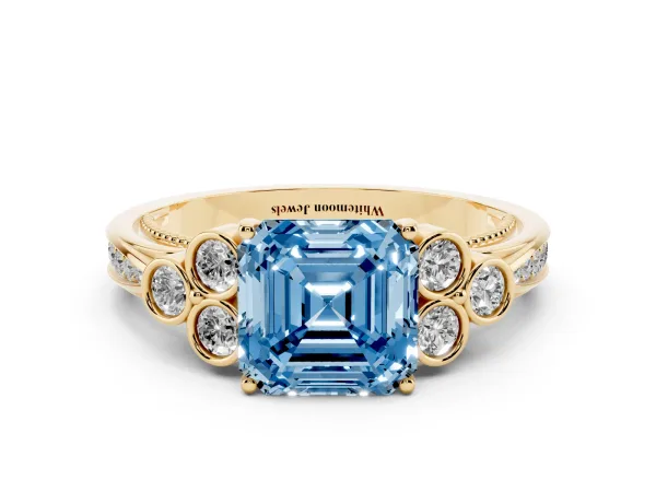 Fancy Blue Asscher Cut Cut Diamond Engagement Ring with Bezel Set Round Side Stones and Prong Setting Yellow gold