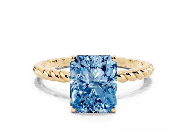 Fancy Blue Radiant Cut Solitaire Twist Band Ring with Four-Prong Setting Yellow gold