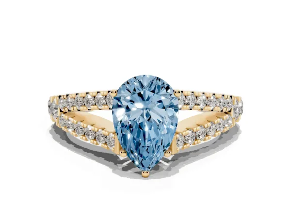 Fancy Blue Pear Cut Diamond Split Shank Engagement Ring with Round Pavé and Prong Setting Yellow gold