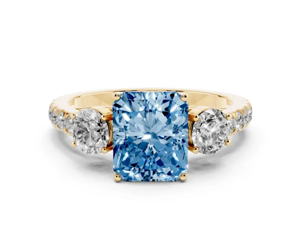 Fancy Blue Radiant Cut Cut Diamond Three-Stone Ring with Round Side Stones and Pavé Band Yellow gold