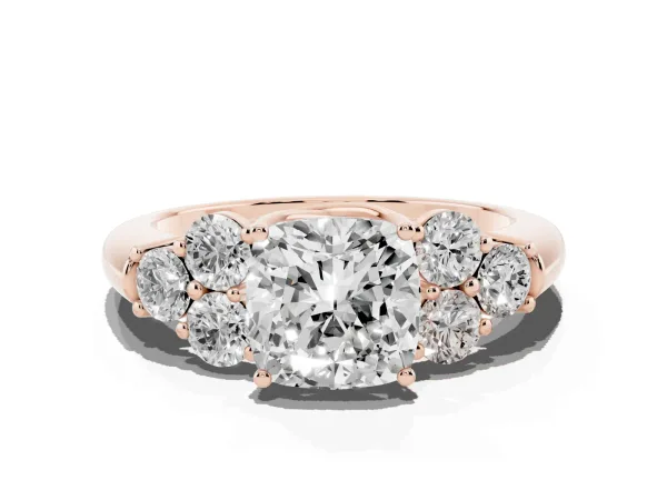 Cushion Cut Cut Diamond Cluster Ring with Round Accent Stones and Prong Setting on a Classic Band Rose gold