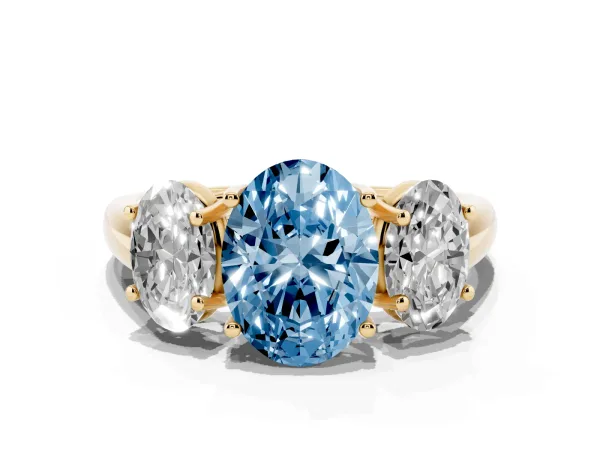 Fancy Blue Three-Stone Oval Cut Diamond Engagement Ring with Prong Setting Yellow gold