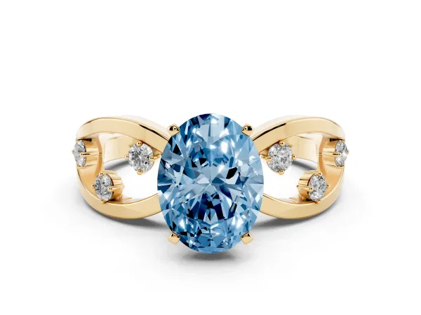 Fancy Blue Oval Cut Cut Solitaire Diamond with Side Stones on Criss-Cross Band and Four-Prong Setting Yellow gold
