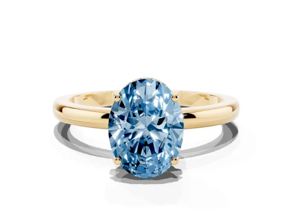 Fancy Blue Oval Cut Solitaire Diamond Ring with Prong Setting and Plain Band Yellow gold