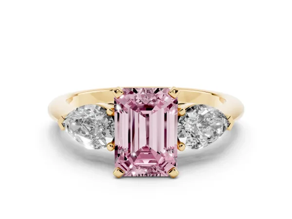 Fancy Pink Three-Stone Emerald Cut Diamond Ring with Pear Side Stones and Four-Prong Setting Yellow gold