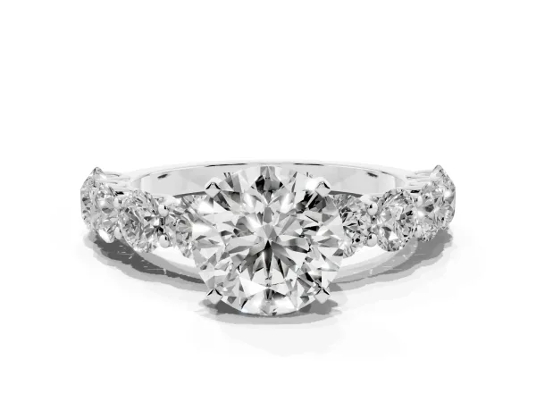 Round Cut Diamond Prong Setting with Side Stones on a Pave Band Platinum