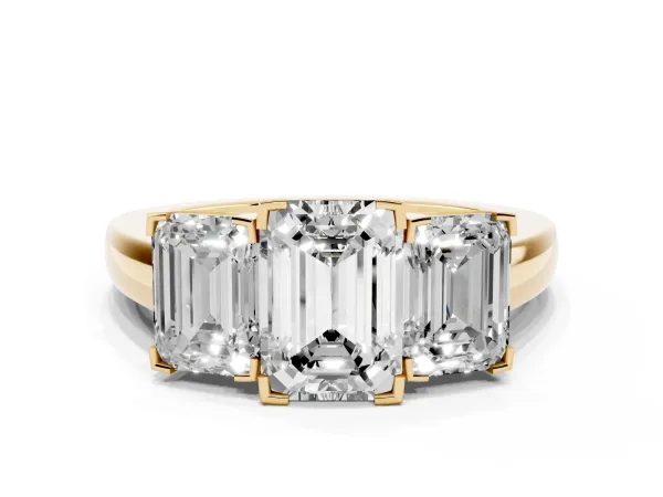 Three-Stone Emerald Cut Cut Diamond Ring with Channel Set Band and Four-Prong Setting Yellow gold