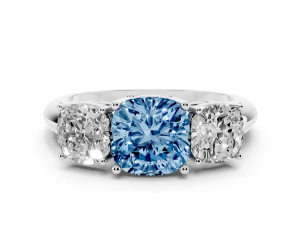 Fancy Blue Three-Stone Cushion Cut Cut Diamond Engagement Ring with Prong Setting on a White Gold Band White gold