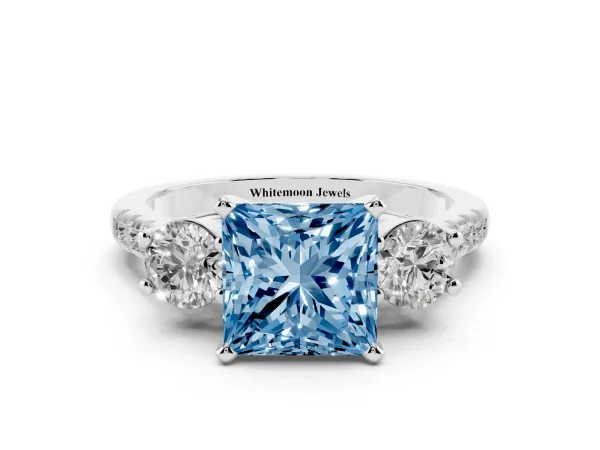 Fancy Blue Three-Stone Princess Cut Diamond Pavé Band with Four-Prong Setting Platinum