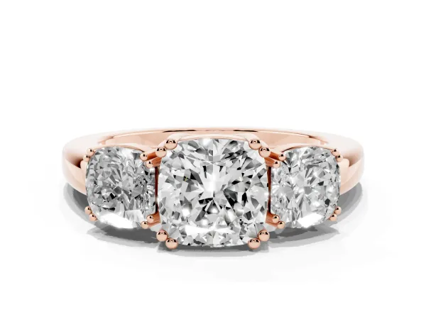 Three-Stone Cushion Cut Cut Diamond Ring with Channel Set Band and Four-Prong Setting Rose gold