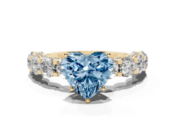 Fancy Blue Heart Cut Diamond Side Stone Engagement Ring with Four-Prong Setting Yellow gold