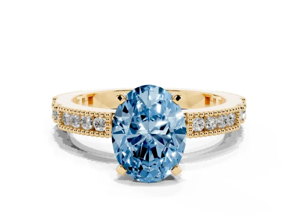 Fancy Blue Oval Cut Solitaire with Pavé Band and Four-Prong Setting Yellow gold