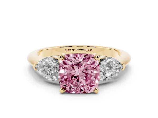 Fancy Pink Three-Stone Cushion Cut Diamond Ring with Pear Side Stones and Four-Prong Setting Yellow gold