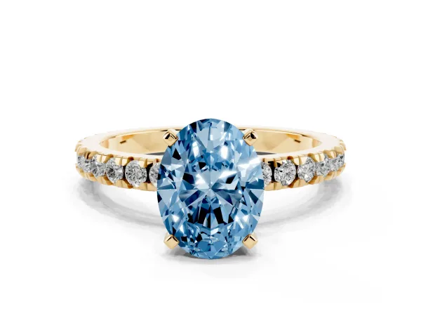 Fancy Blue Oval Cut Diamond Pavé Band Solitaire with Four-Prong Setting Yellow gold