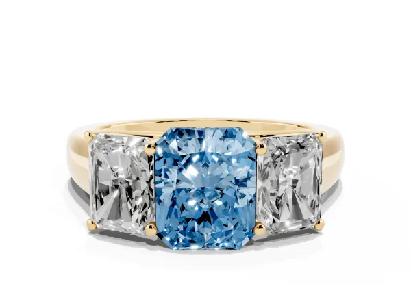 Fancy Blue Radiant Cut Three-Stone Diamond Ring with Prong Setting on a Classic Band Yellow gold