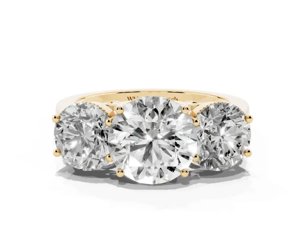 Three-Stone Round Cut Diamond Engagement Ring with Prong Setting on a Classic Band Yellow gold