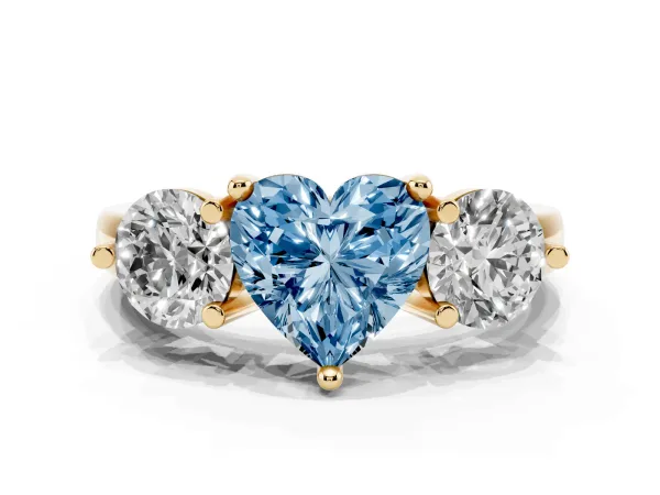 Fancy Blue Three-Stone Heart Cut Brilliant Cut Solitaire Ring with Prong Setting on a Classic Band Yellow gold
