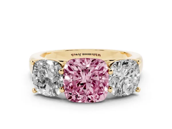 Fancy Pink Cushion Cut Three-Stone Diamond Ring with Prong Setting on a Classic Band Yellow gold