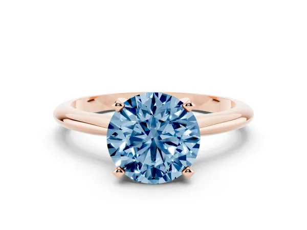 Fancy Blue Round Cut Cut Solitaire Ring with Four-Prong Setting on a Classic Band Rose gold
