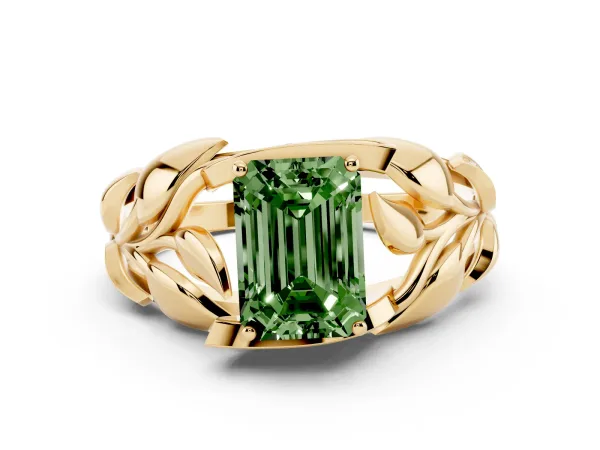 Fancy Green Emerald Cut Diamond Leaf-Inspired Engagement Ring with Round Accents and Prong Setting Yellow gold