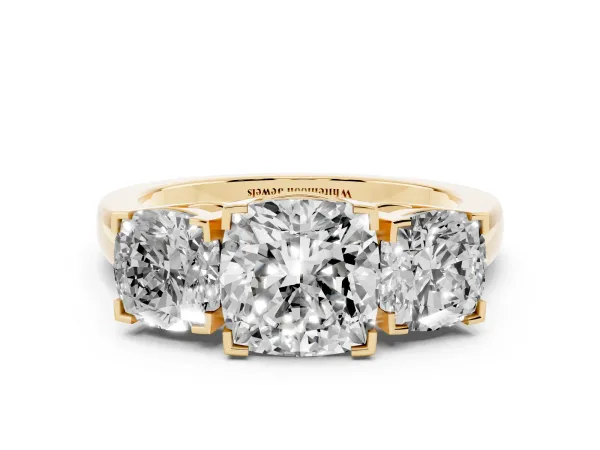 Three-Stone Cushion Cut Cut Diamond Ring with Channel Set Band and Four-Prong Setting Yellow gold