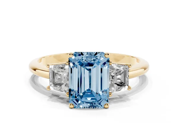 Fancy Blue Emerald Cut Diamond Three-Stone Ring with Trapezoid Side Stones and Prong Setting Yellow gold