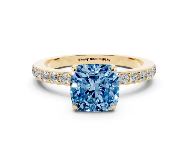 Fancy Blue Cushion Cut Diamond Pavé Engagement Ring with Round Accents and Prong Setting Yellow gold
