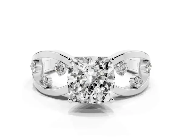 Cushion Cut Cut Solitaire Diamond with Side Stones on Criss-Cross Band and Four-Prong Setting Platinum