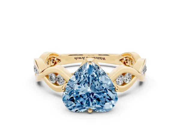 Fancy Blue Heart Cut Solitaire Twist Band with Leaf Prong Setting Yellow gold