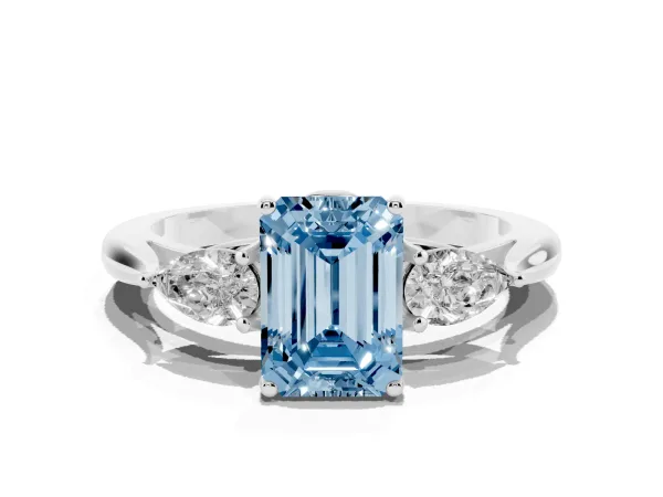 Fancy Blue Three-Stone Emerald Cut Brilliant Diamond Solitaire Ring with Tapered Band and Four-Prong Setting White gold