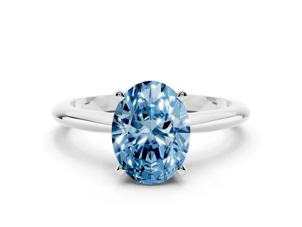 Fancy Blue Oval Cut Cut Solitaire Ring with Four-Prong Setting on a Classic Band Platinum