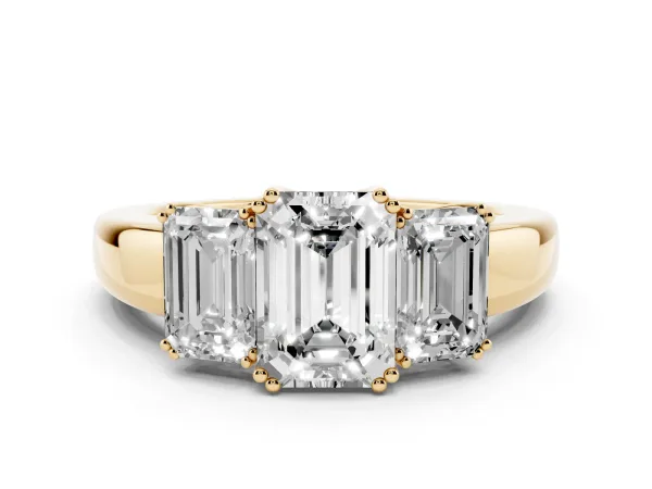 Three-Stone Emerald Cut Cut Diamond Ring with Channel Set Band and Four-Prong Setting Yellow gold