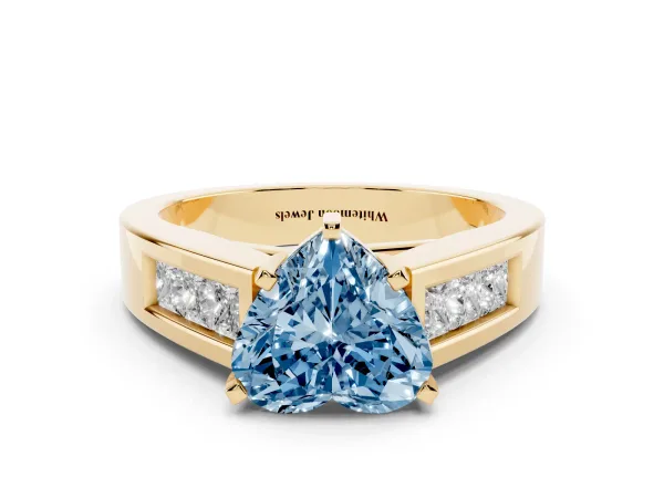 Fancy Blue Heart Cut Cut Channel Set Solitaire Ring with Four-Prong Setting Yellow gold