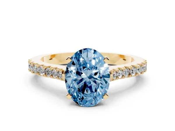 Fancy Blue Oval Cut Cut Solitaire Diamond Engagement Ring with Pave Band and Four-Prong Setting Yellow gold