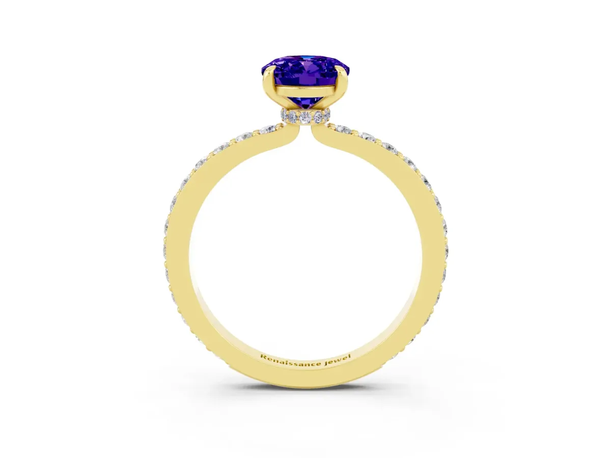 Oval Cut Tanzanite Solitaire Engagement Ring with Pavé Band and Four-Prong Setting Yellow gold