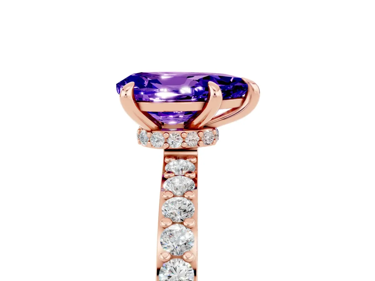 Pear Cut Tanzanite Solitaire Engagement Ring with Pavé Band and Four-Prong Setting Rose gold