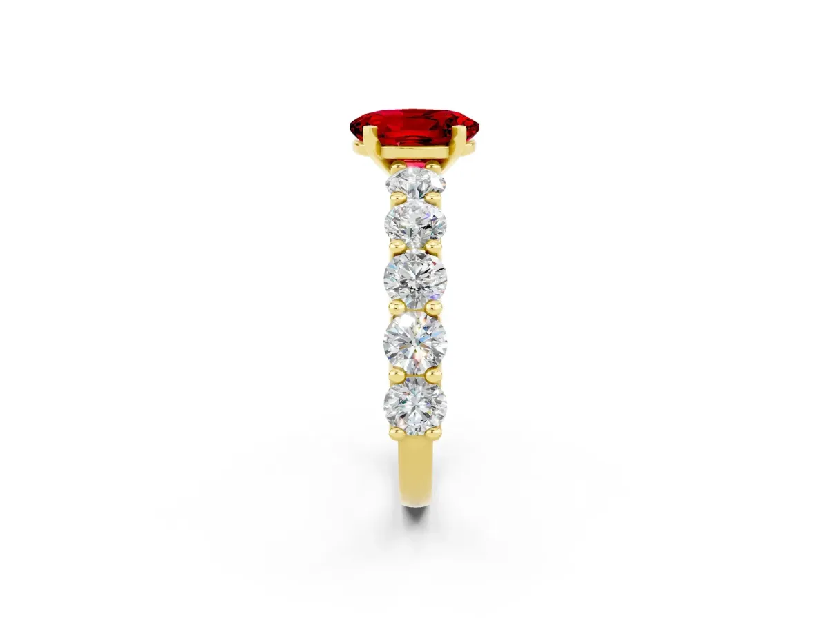 Oval Cut Ruby Prong Setting with Side Stones on a Pave Band Yellow gold