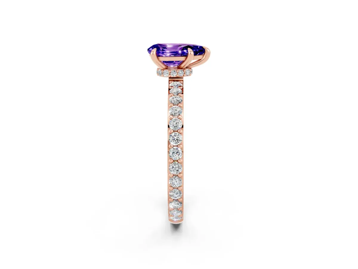 Pear Cut Tanzanite Solitaire Engagement Ring with Pavé Band and Four-Prong Setting Rose gold
