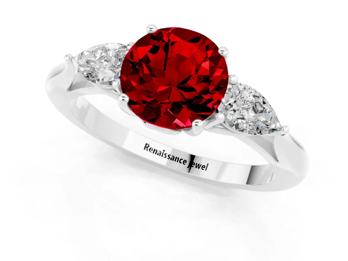 Three-Stone Round Cut Ruby Ring with Pear Side Stones in Four-Prong Setting Platinum