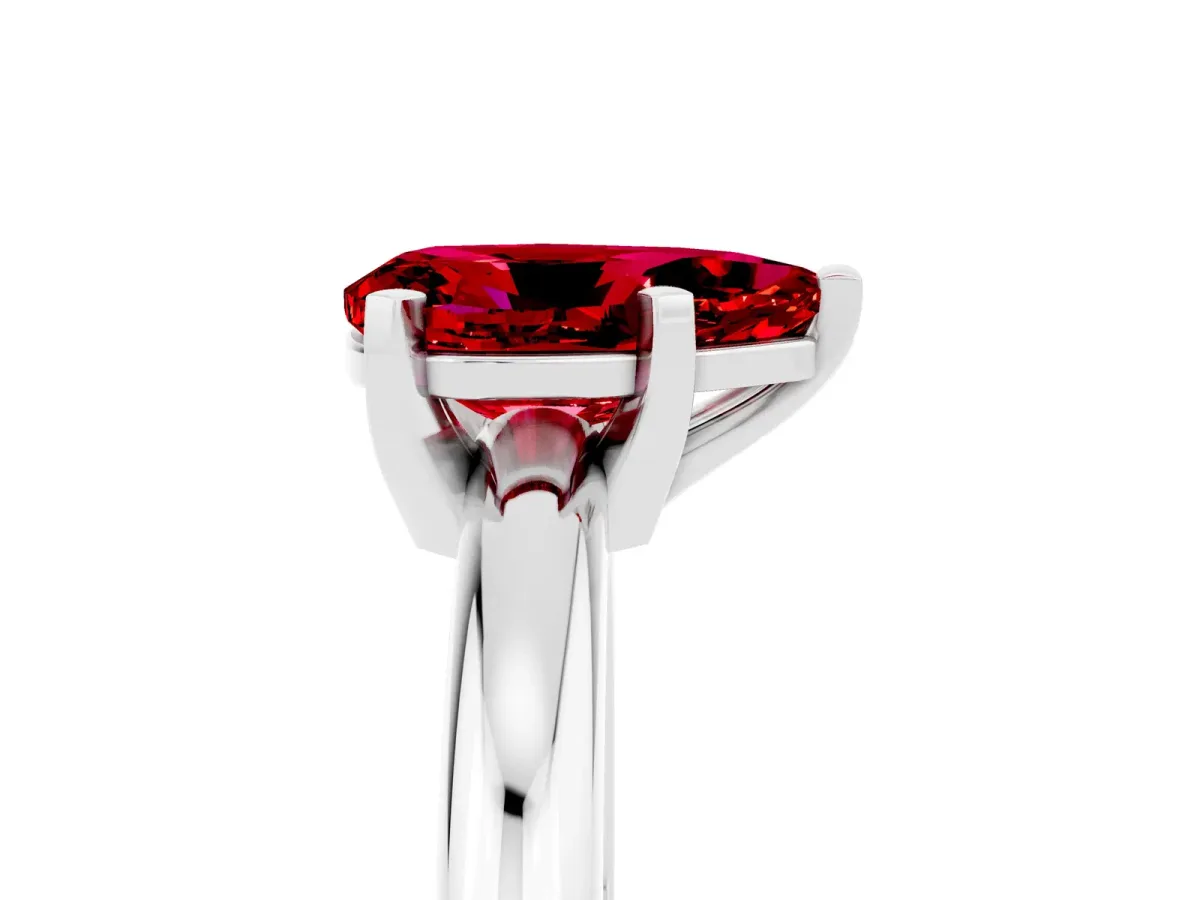 Pear Cut Ruby Solitaire Engagement Ring with Round Band and Four-Prong Setting Silver