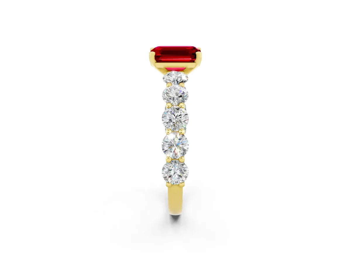 Emerald Cut Ruby Prong Setting with Side Stones on a Pave Band Yellow gold