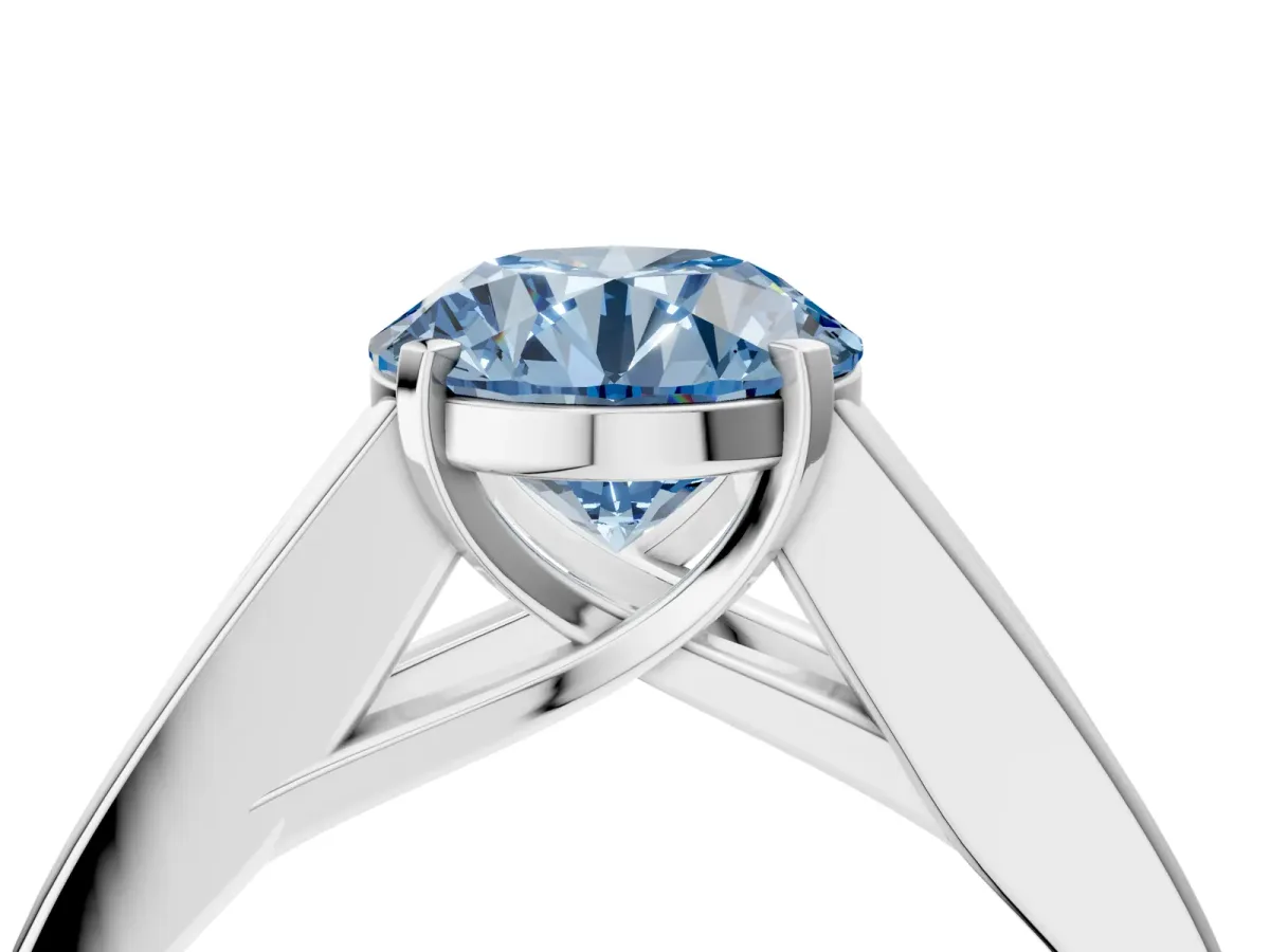 Fancy Blue Round Cut Cut Channel Set Solitaire Ring with Four-Prong Setting Silver