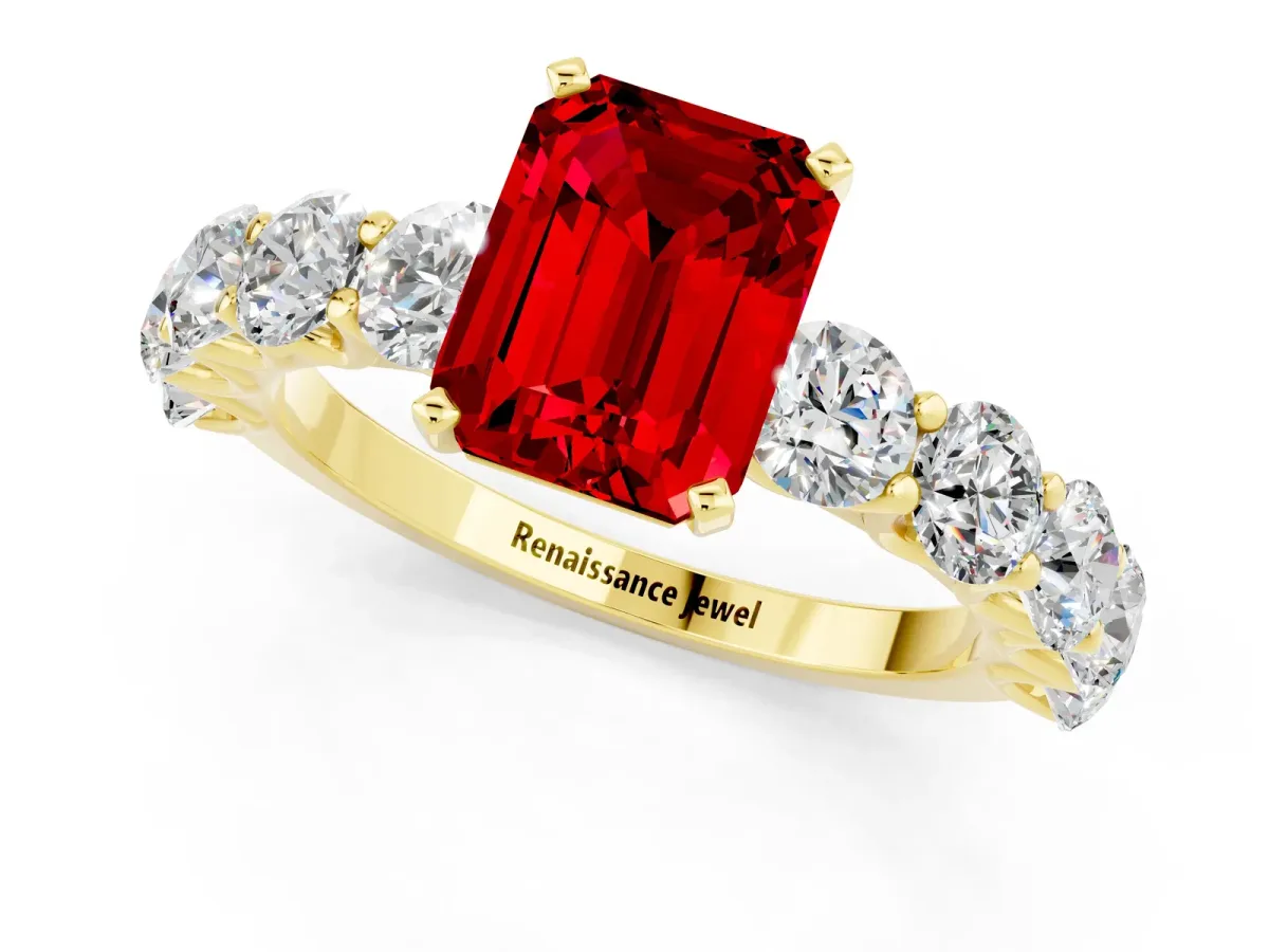 Emerald Cut Ruby Prong Setting with Side Stones on a Pave Band Yellow gold
